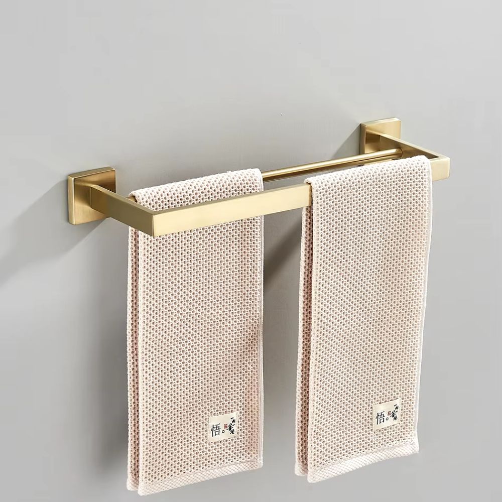 porta toalha metálico dourado