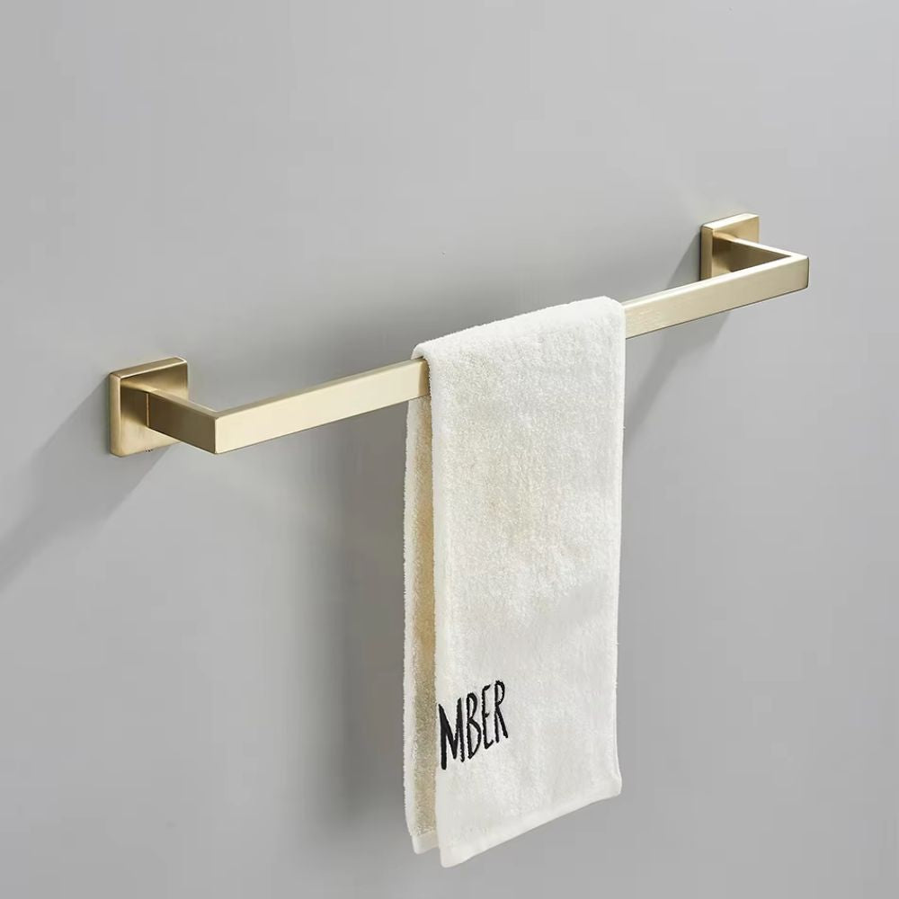 porta toalha metálico dourado